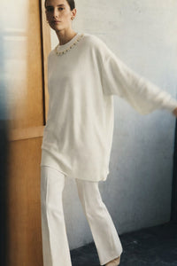 SWEATER WITH A BEADED COLLAR